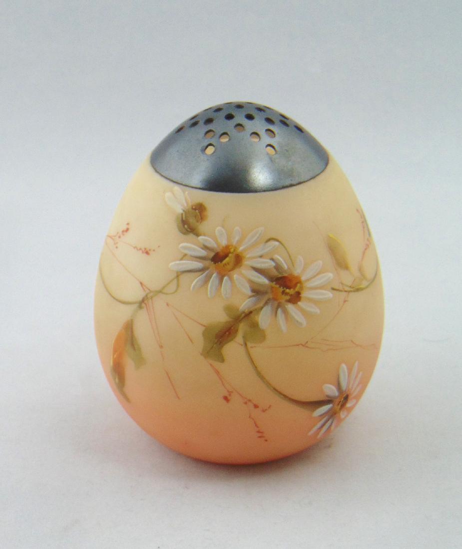 Crown Milano Egg Sugar: Egg shape shaker in rose shading to amber decorated with stemmed daisies, 4" ht. Condition: no defects found