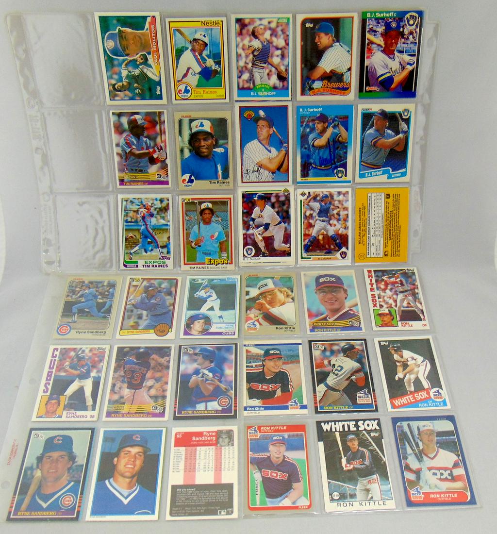 Group of 50 baseball cards: Various years and players including 12 Ryne Sandberg, 11 Ron Kittle cards, 5 Jody Davies, 6 Tim Raines, and 17 B. J. Surhoff one with autograph. Condition: good with no defects found