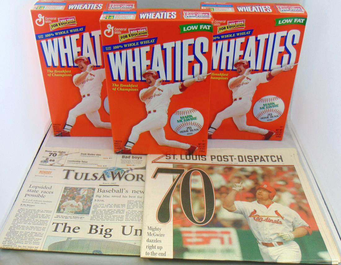 Group of Mark McGwire 70 homer items: Including three 1999 un-opened wheaties boxes, a copy of the Tulsa World newspaper from Sept 28 1998, and a St. Louis Post Dispatch paper from Sept 28 1998. Condition: good with no defects found.