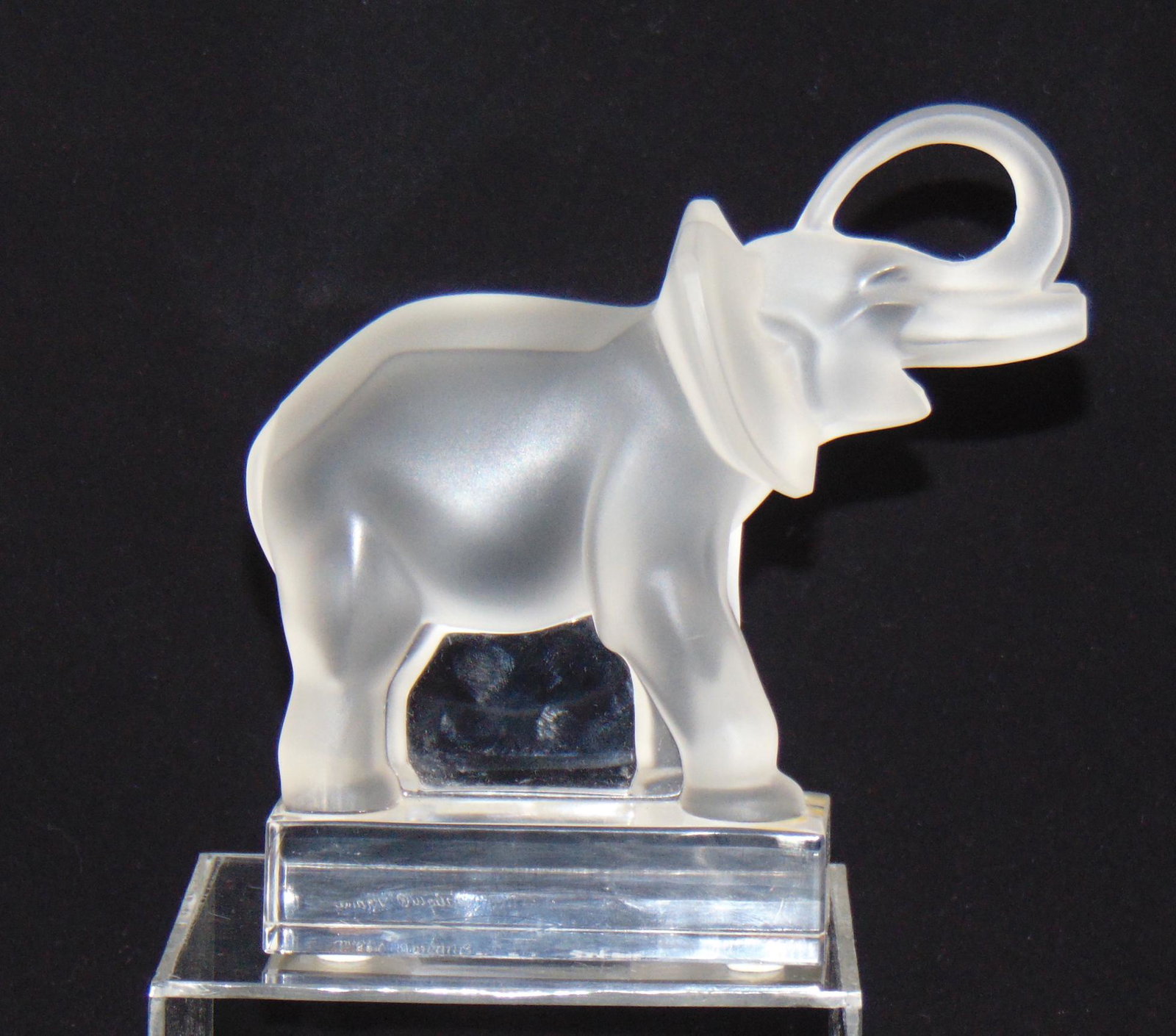 Lalique figural glass Elephant: Lalique glass figurine of an attacking elephant, signed Lalique France and carries Marie Claude Lalique initials, 6 1/2" ht. Condition: good with no defects found.