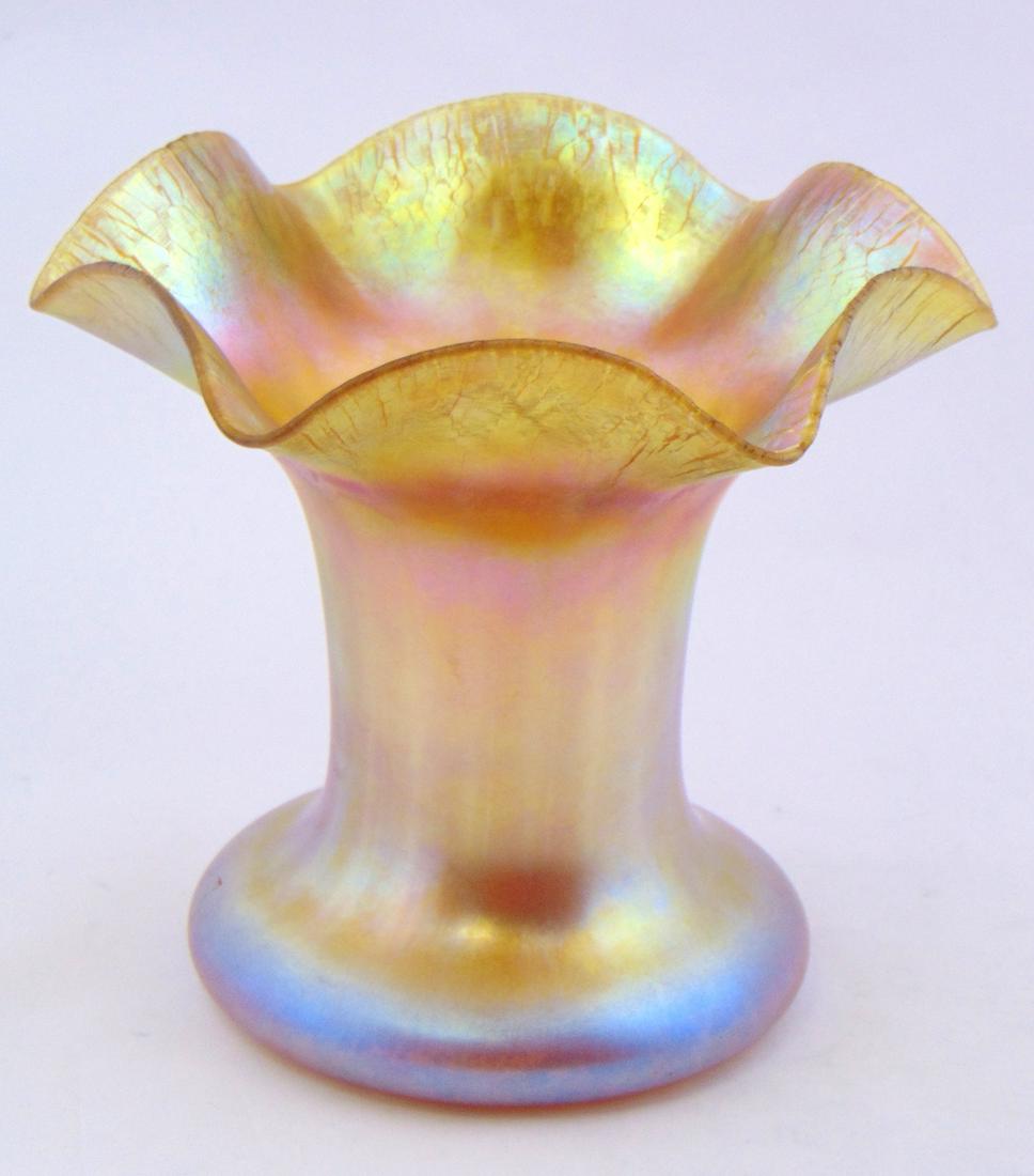 Large Quezal scalloped rim vase,: Optic ribbed vase with a spreading onion skin scalloped rim, signed Quezal 6 1/2" ht. Condition: good with no defects found