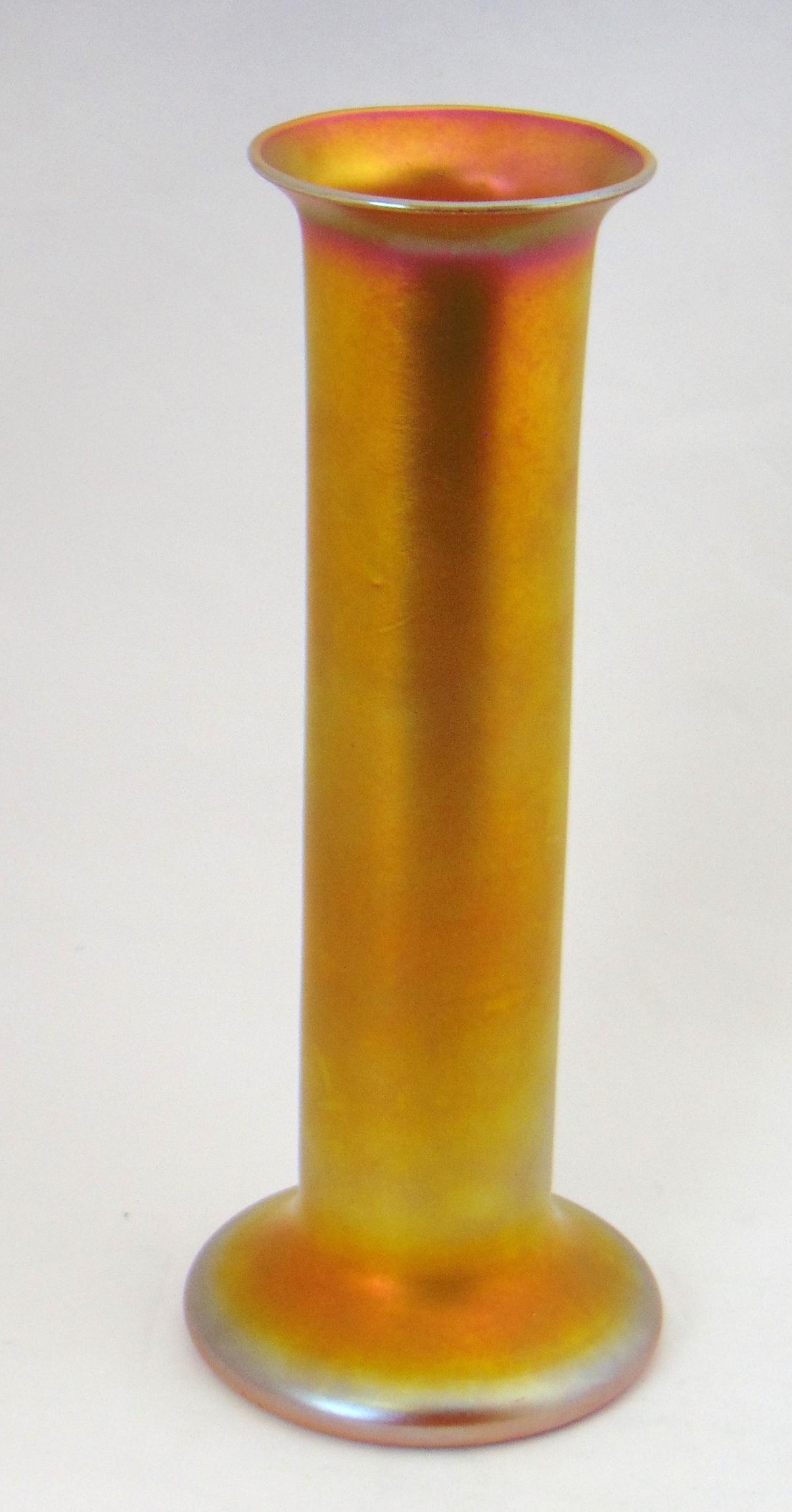 Large Quezal iridescent gold vase,: Cylindrical form with a spreading rim and foot, 12" ht. Condition: good with no defects found