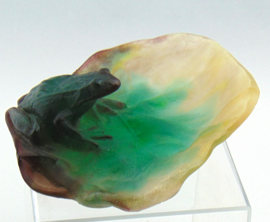 Daum Nancy Pate de Verre frog,: Green figural frog set on a purple to green to amber lily pad in Pate de Verre glass, signed Daum Nancy, 6 1/4" wide. Condition: good with no defects found.