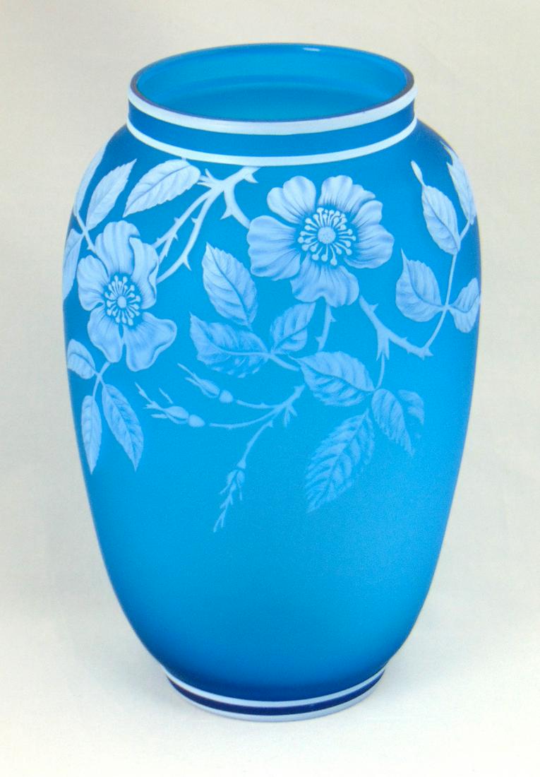 Large Webb Prussian blue cameo vase,: Shouldered form in Prussian Blue glass decorated with a cascading dogwood blossoms, with a butterfly on the reverse, 10" ht. Condition: good with no defects found