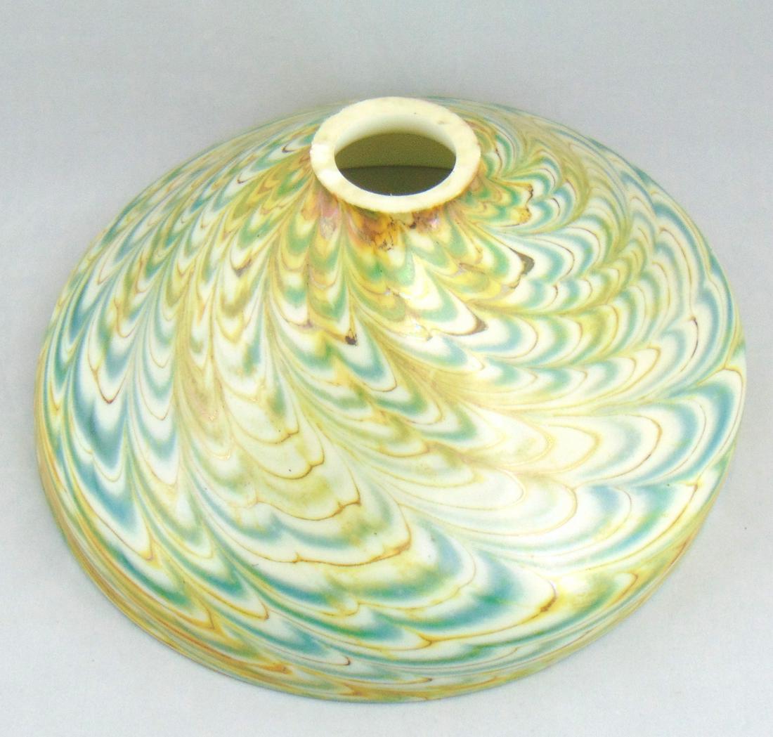 Large iridescent glass shade: Dome form in opal glass decorated with blue and yellow undulating swags, 10" wide. Condition: good but with fitter chips.