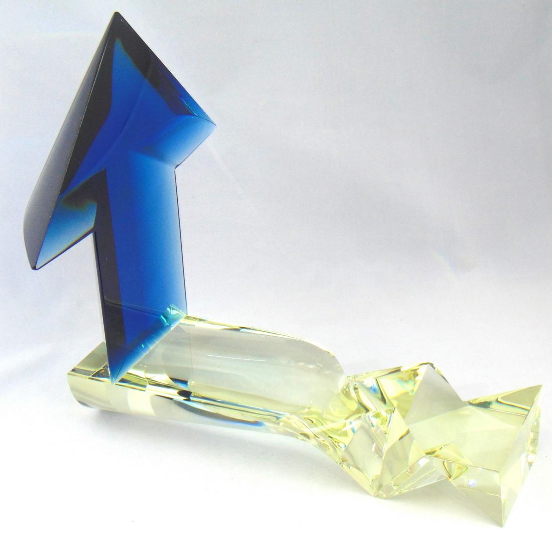 Bratislav Novak Jr. art glass sculpture: Free form canary sculptured base holds a Prussian blue arrow, signed B. Novak Jr. 99, 13 1/2" long. By 12 1/2" ht. Condition: good with no defects found.