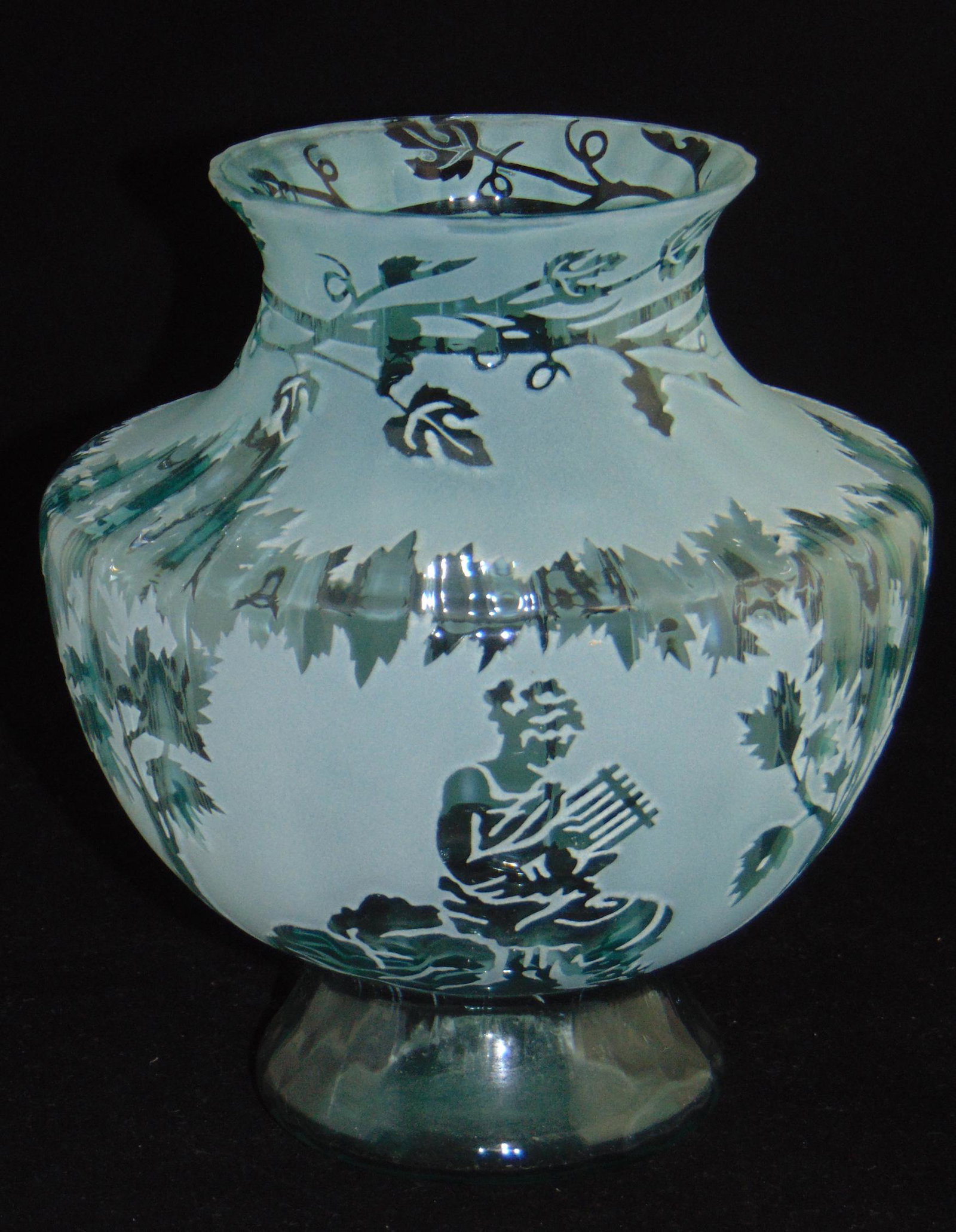 Kelsey Murphy cameo glass vase: Footed shouldered form in turquoise glass decorated with Romanesque figures, has original paper work, signed Kelsey/Pilgrim, 1992, 8" ht. Condition: good with no defects found.