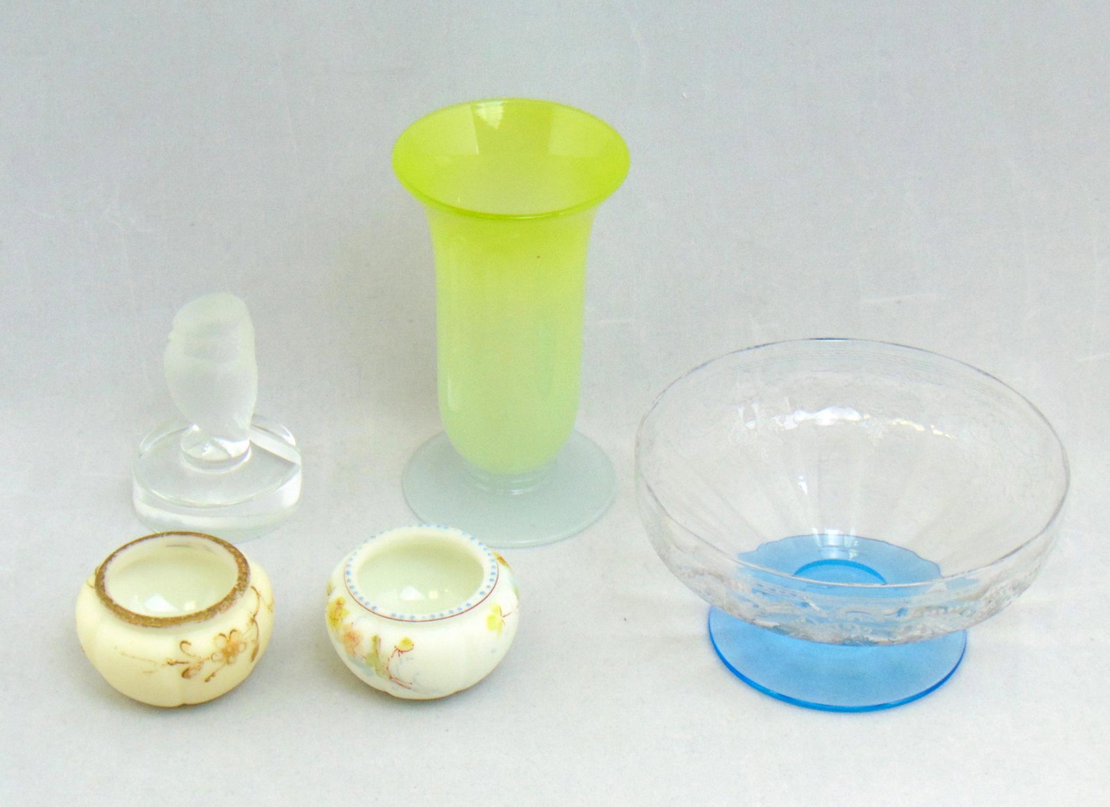 Group of decorative glass: Including a Stevens and Williams parfait, a Lalique owl, and an etched dish and two Smith Brothers open salts, tallest 4 1/2" ht. Condition: good, minor wear to the top of the Smith Brothers