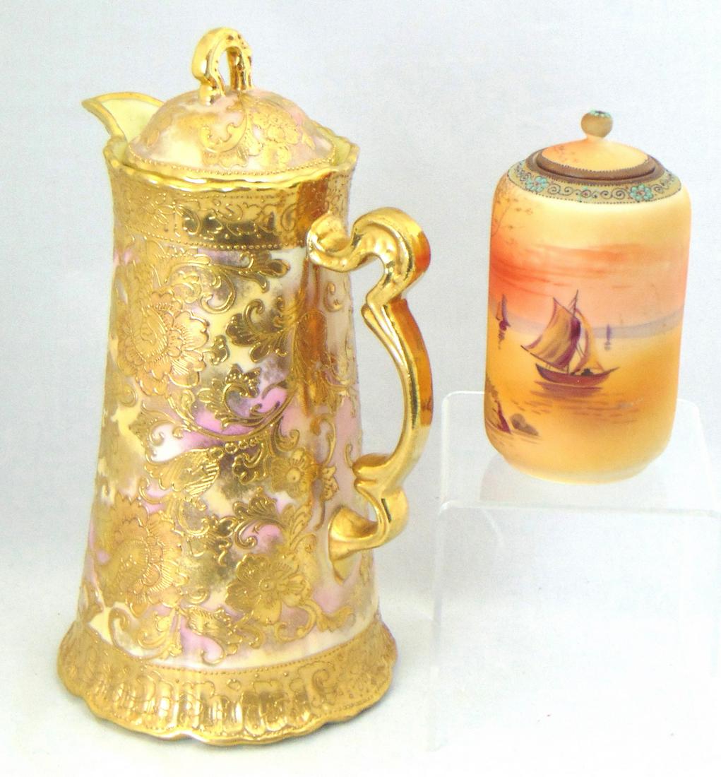 Two pieces of Nippon porcelain: The first a coffee/tea pot in in pink and cream decorated with overall gold scrolling, together with a covered jar with a sailboat scene, Each marked Nippon, tallest 10 1/2" ht. Condition: good with n