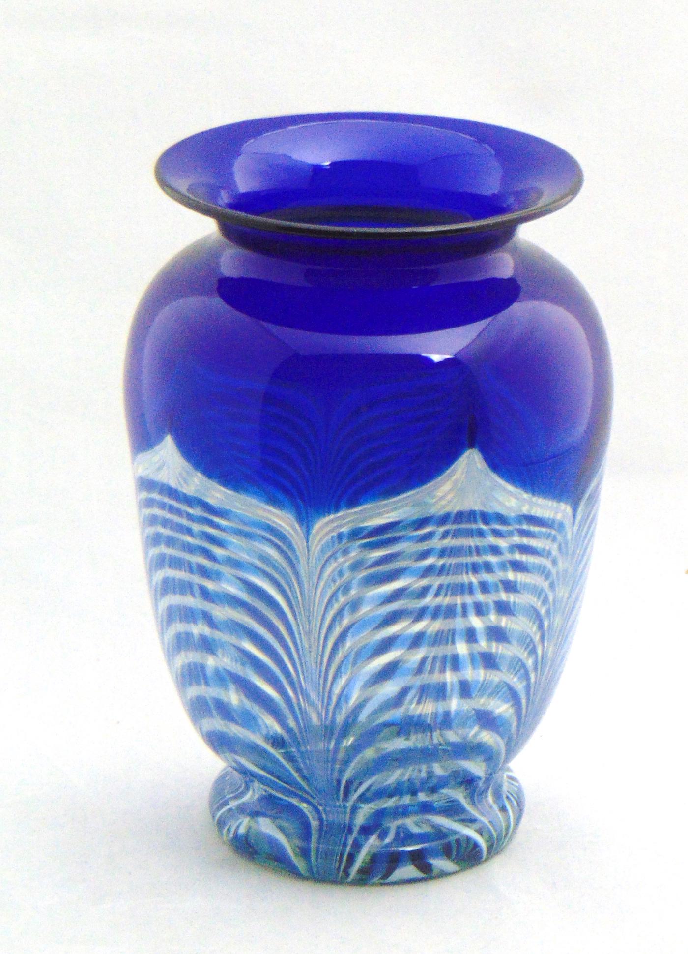Durand Blue art glass vase: Prussian blue shouldered glass vase on an Ambergris ground decorated with a white pulled feather, 7 1/4" ht. Condition: good with no defects found.