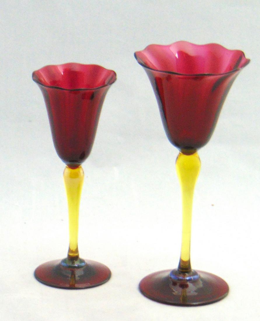Two Ruby Durand glass goblets: Consisting of a large and a medium ruby glass goblet with scalloped rims and an ambergris standard, 6 1/2" ht. PROVENANCE: Earlys Auction to the black collection. Condition: good with no defects found