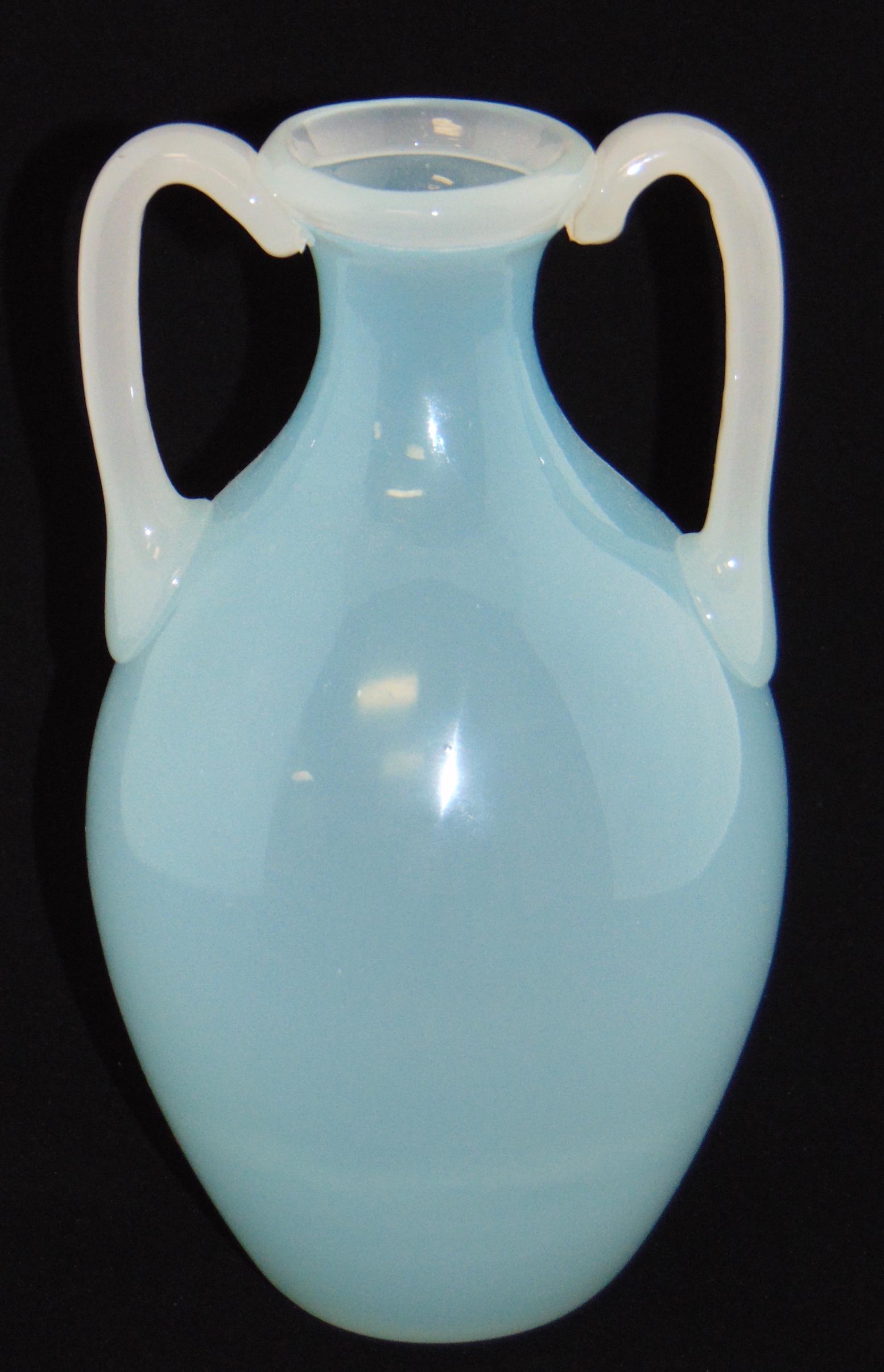 Two handle Blue Jade glass vase: Ovoid form in light blue Jade adorn with two side handles, attributed to Stevens and Williams, 8" ht. Condition: good with no defects found.