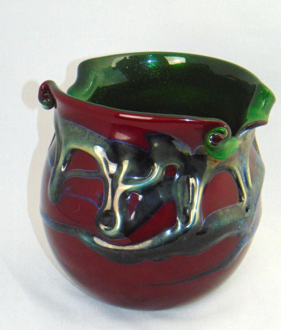 Charles Lotton Bing Cherry Lava: Rarely seen Bing Cherry Lave, ovoid form in red glass decorated with a blue to green Lave flow and accented with an aventurine interior, signed Charles Lotton 2005, 6 1/2" ht. Condition: good with no 