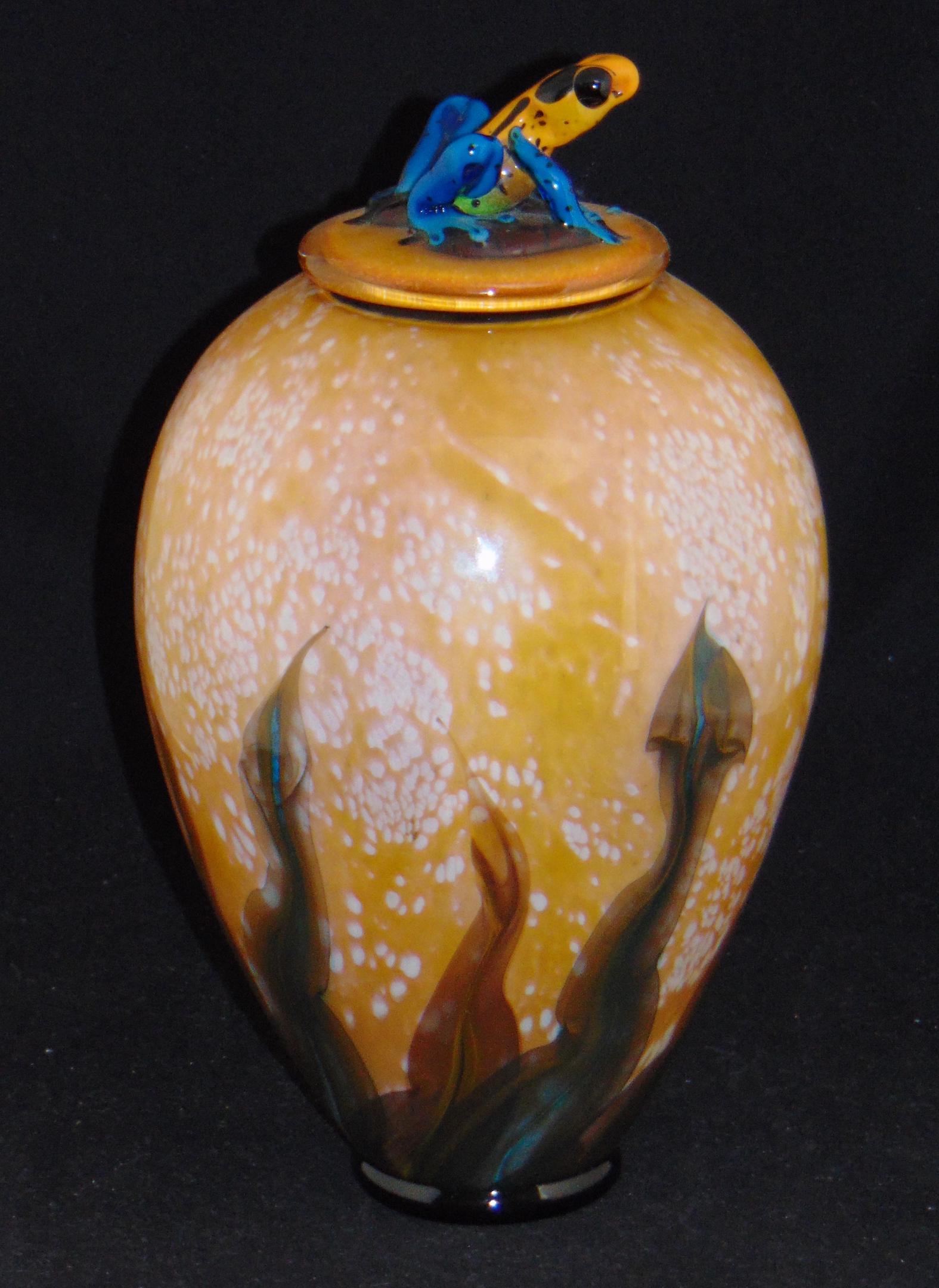 David Smallhouse covered jar: Ovoid form in mottled brown glass fitted with a frog finial lid, jar and lid signed 10-2008 -46 Smallhouse, 13" ht. Condition: good with no defects found