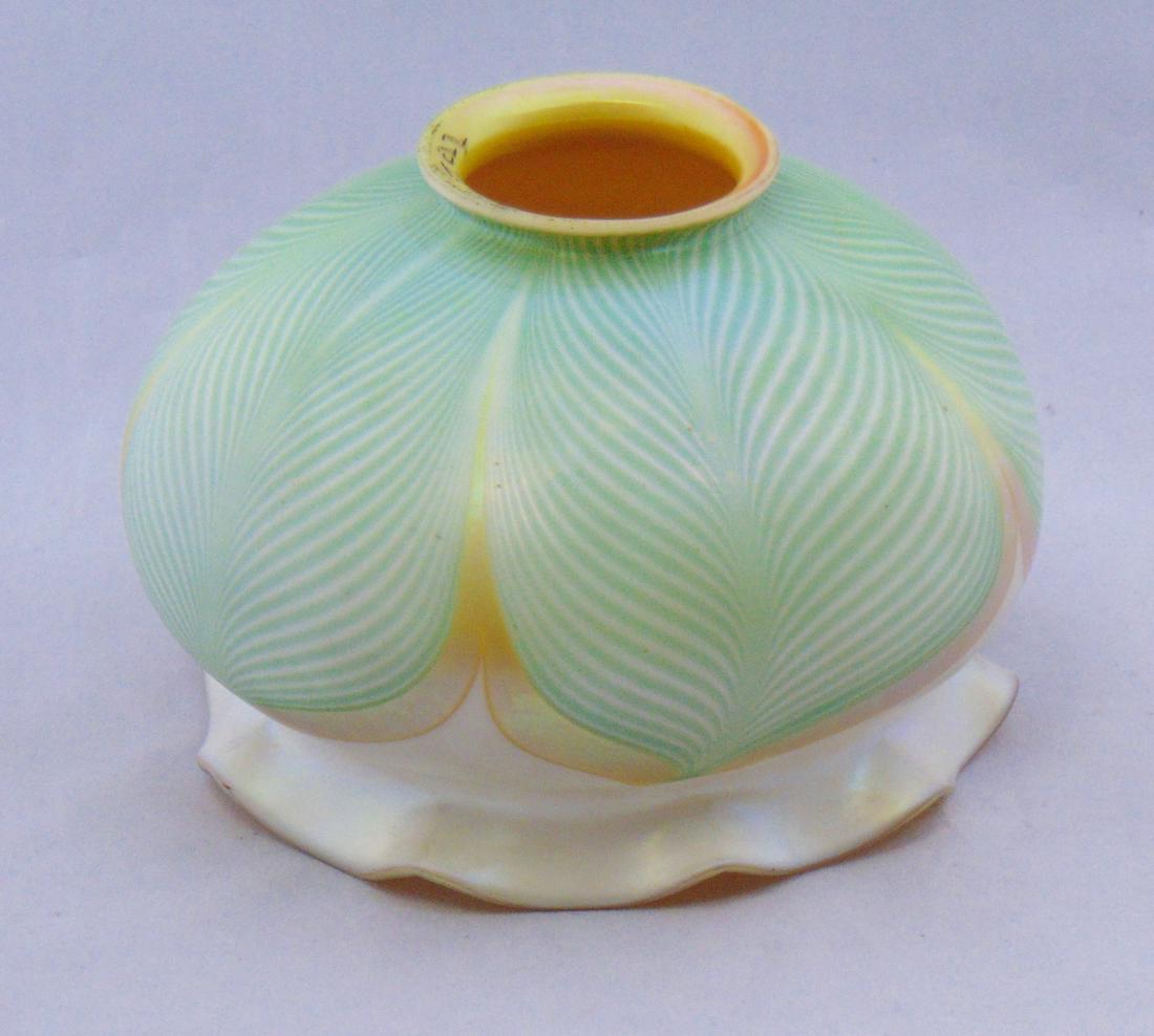 Quezal dome pulled feather glass shade: Ovoid scalloped rim form in opal glass decorated with green pulled feather tipped in gold, signed Quezal, 2 1/4" fitter, 4" ht. Condition: chips to the fitter