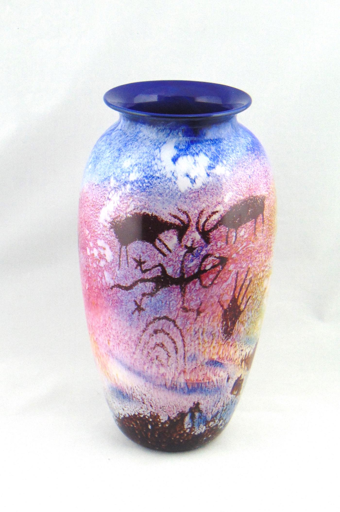 Rick Satava blue glass Petro glyph: Rare blue color shouldered form in mottled blue decorated with cave drawings, signed R Satava 1791-91, 11 1/2" ht. Condition: good with no defects found.