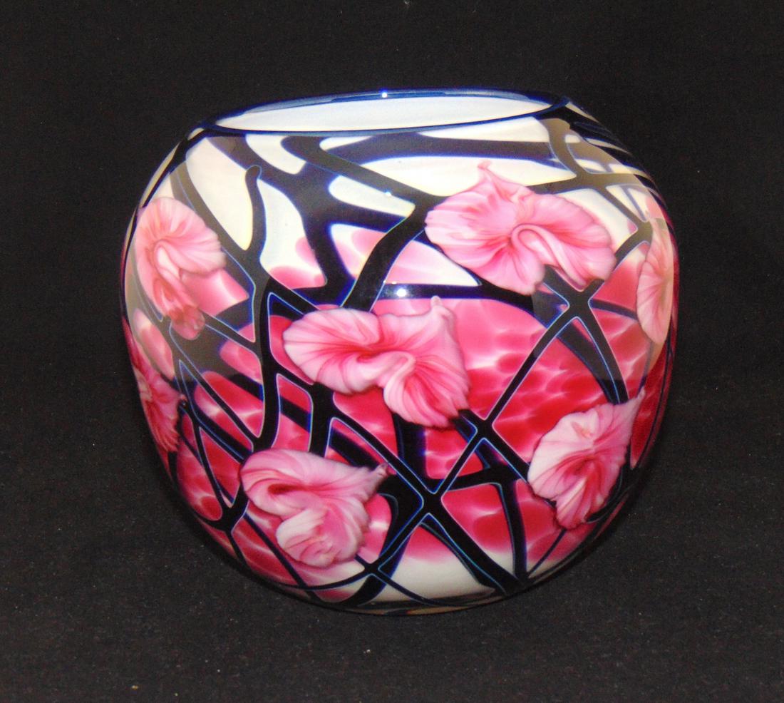 John Lotton double wall glass vase: Ovoid double wall form in white glass with internal red spatter adorned with a blue vine carrying red multi flora, signed John Lotton 1991, 8" ht. Provenance: Purchased at Riley Humler for 3000 in Jun