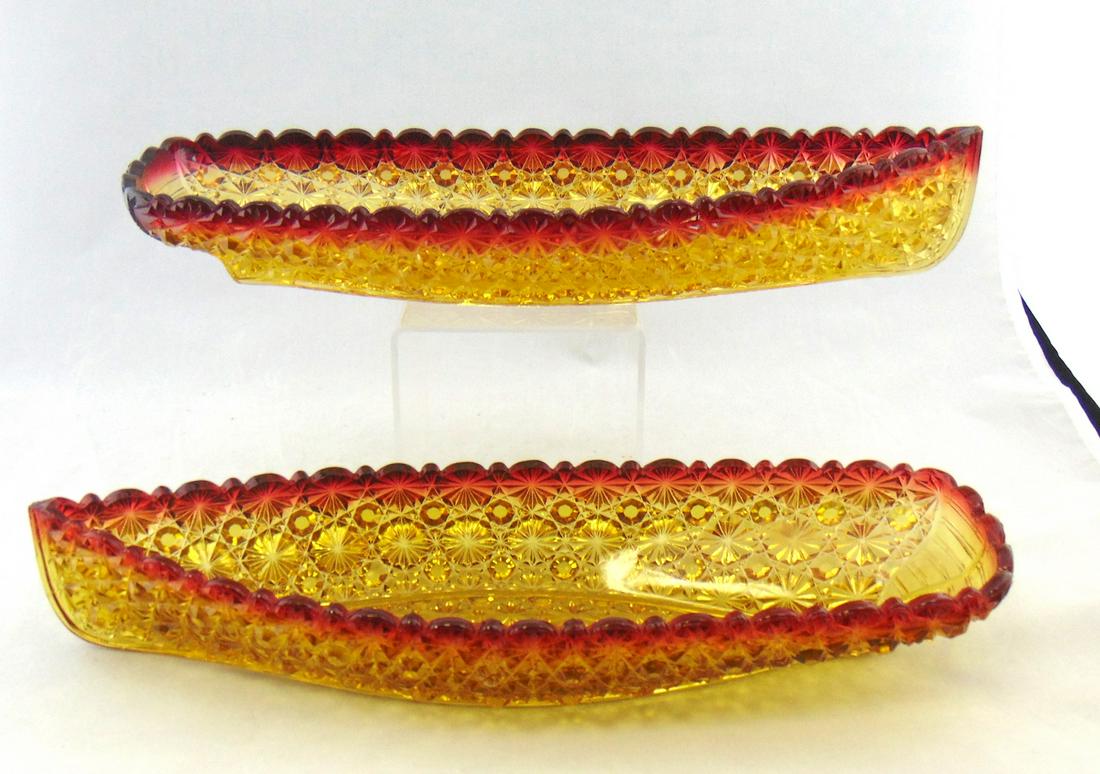 Hobbs pressed Amberina canoes: Two Hobbs pressed Amberina canoes in the daisy and button pattern, large ship form, 14" long. Condition: good with minor roughness to the point of one larger.
