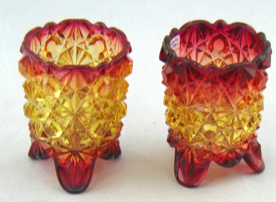 Pair of Hobbs Amberina glass toothpicks: Footed cylindrical form in the daisy and button pattern, 2 3/4" ht. PROVENANCE: Earlys Auction to the Black collection. Condition: good with no defects found