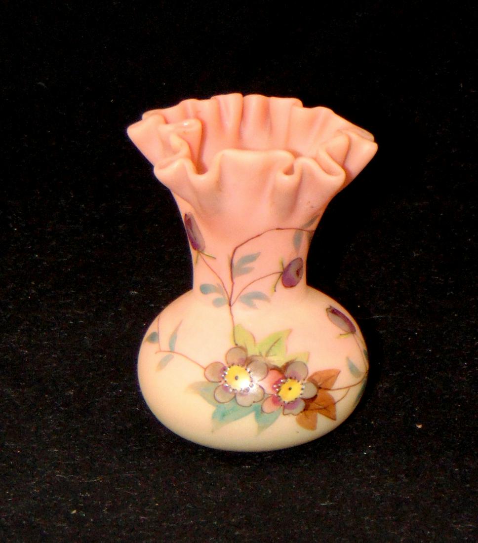 Webb Burmese glass vase: Bulbous stick form with a spreading ruffled rim decorated in the Hawthorn pattern, 3 3/4" ht. Condition: good with no defects found.