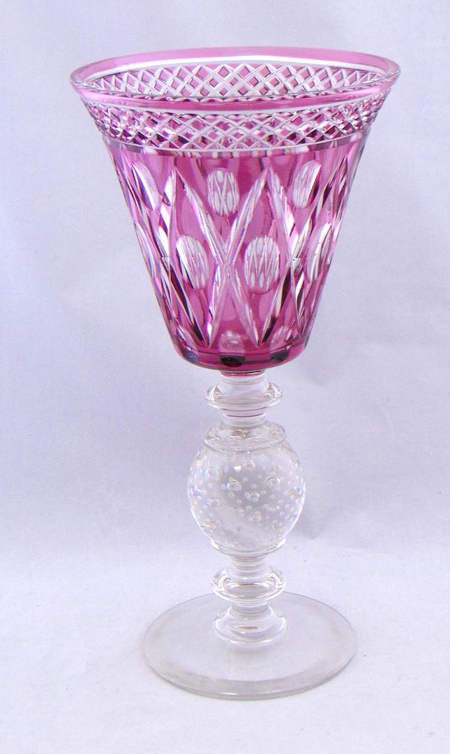 Pairpoint cut glass stemmed compote: Footed compote with a control bubble standard and an amethyst cut top, 11 3/4" ht. Condition: good with no defects found.