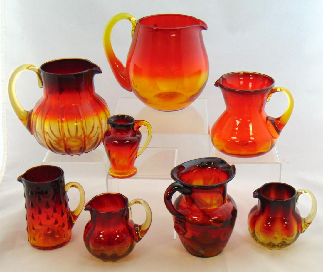 8 mid century Amberina glass pitchers: Eight mid century Amberina glass pitchers from Gibson, Imperial, Kanawha, and MMA, tallest 5 1/2" ht. Condition: good with no defects found.