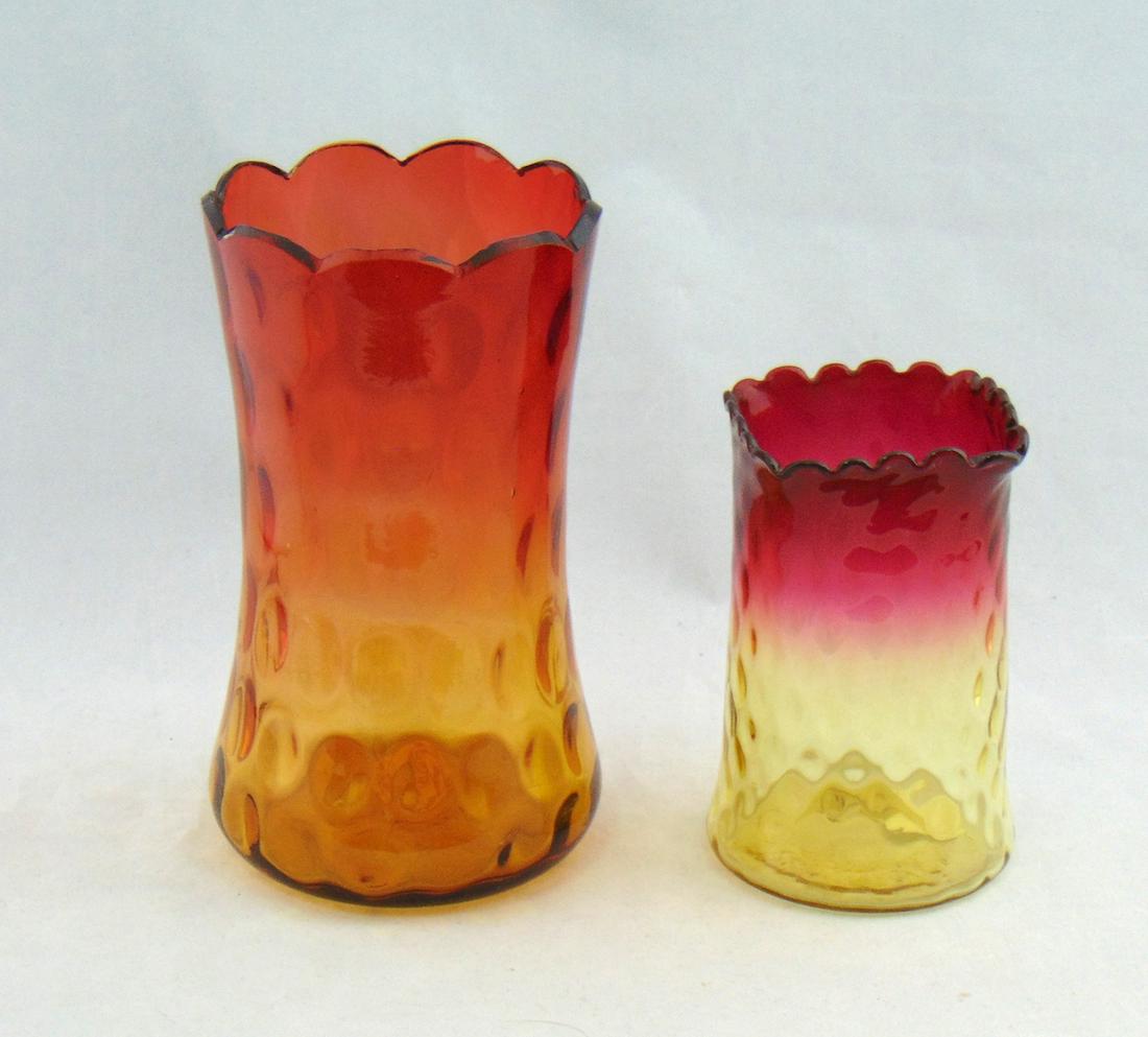 Two Amberina celery glass vases: Including a New England in the optic diamond pattern, together with a larger coin spot, 6 1/2" ht. PROVENANCE: Earlys Auction to the Black collection. Condition: good with no defects found