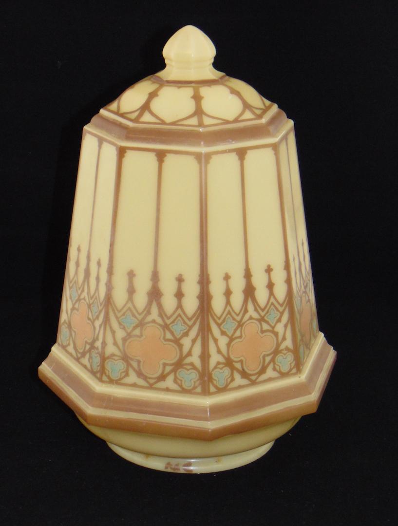 Art Deco hanging glass lamp: Opaline glass hanging lamp in caramel glass in a faceted form with Art Deco panels, shade 14" ht. with fixture 18" ht. Condition: glass good with no defects, fixture could use paint.