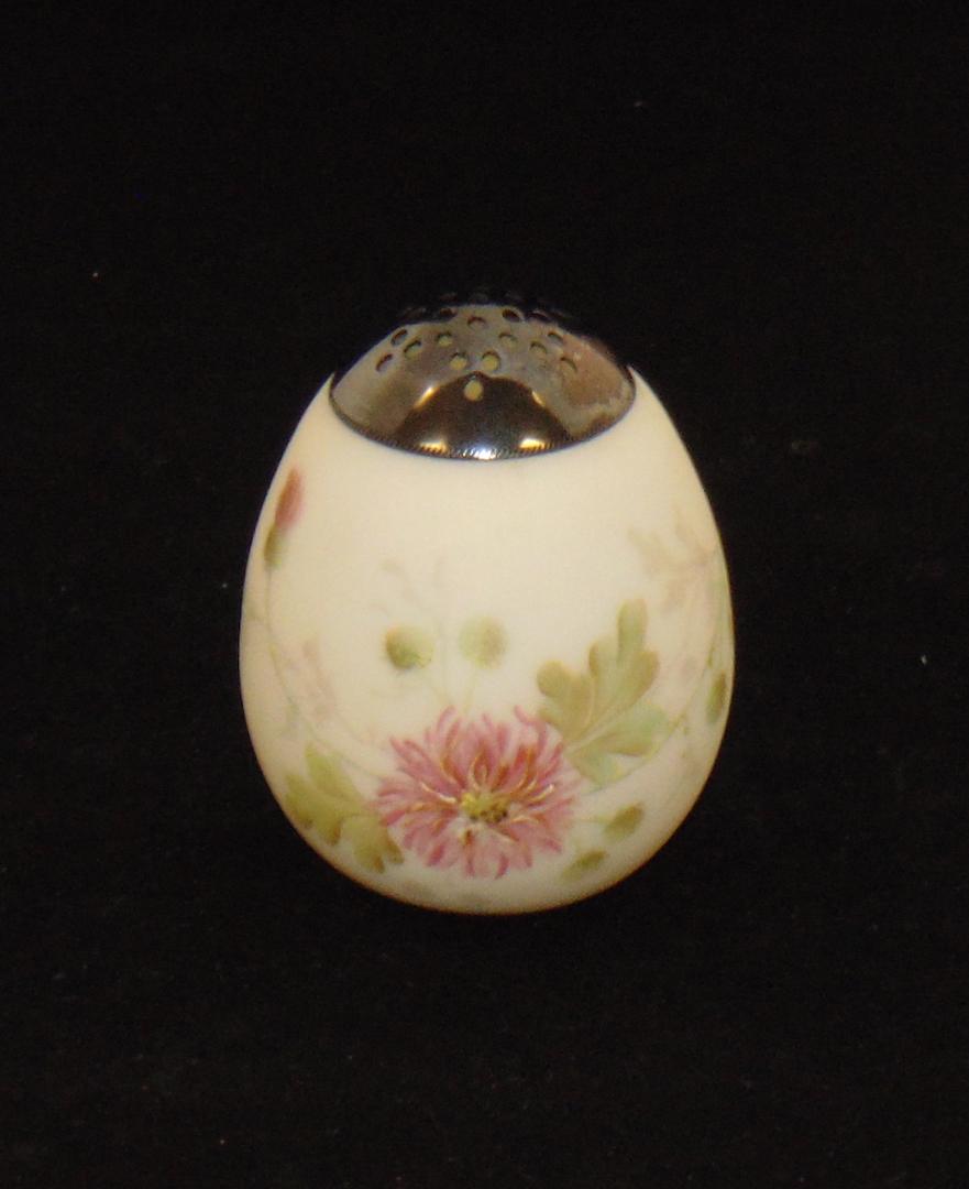 Mt. Washington Crown Milano shaker: Egg form in opal glass decorated with large yellow and pink mums, 4" ht. Condition: good with no defects found.