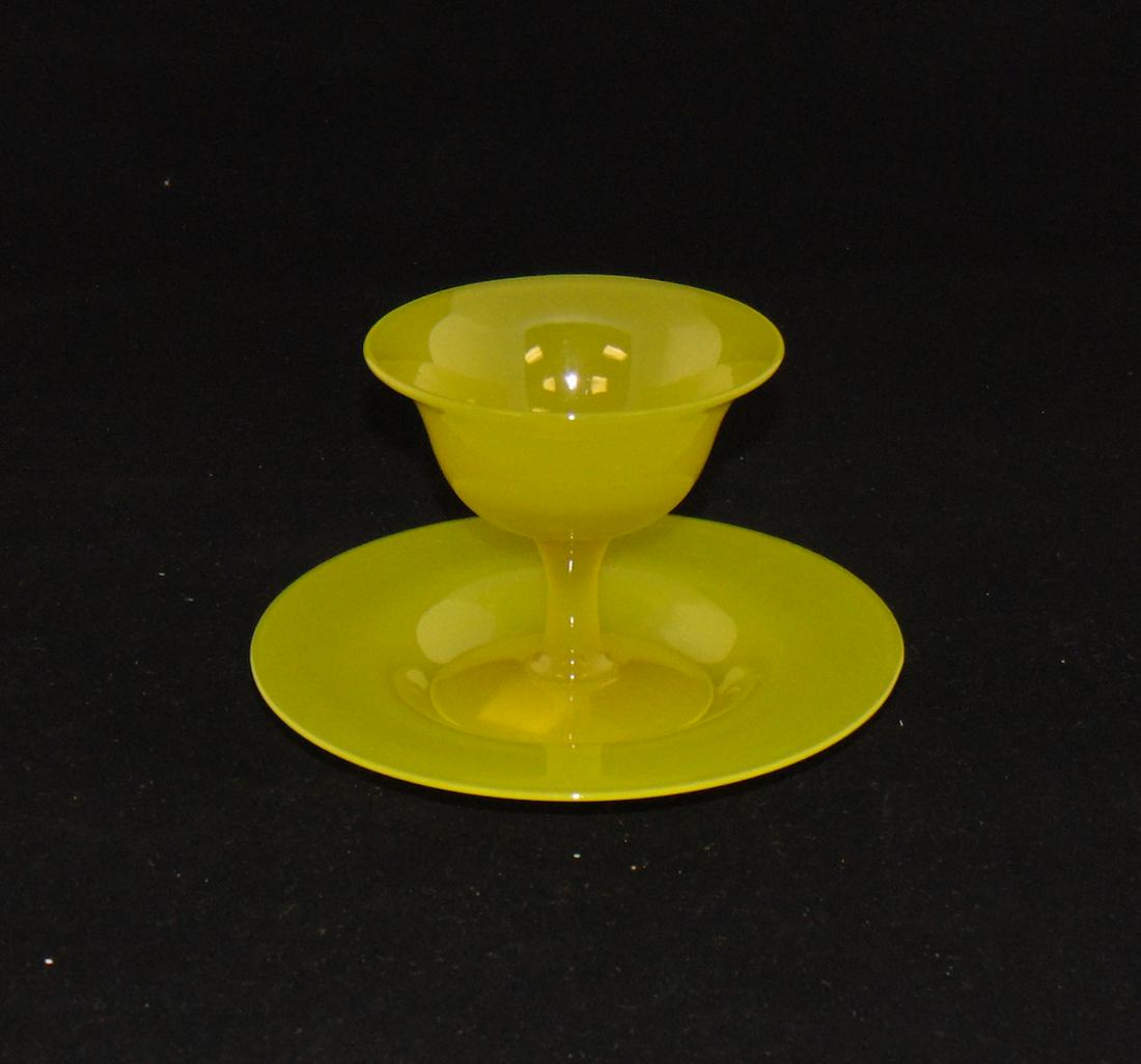 Steuben yellow Jade sherbet and plate: Steuben yellow Jade sherbet and matching underplate, 6" wide. PROVENANCE: Earlys Auction to the Black collection. Condition: good with no defects found.