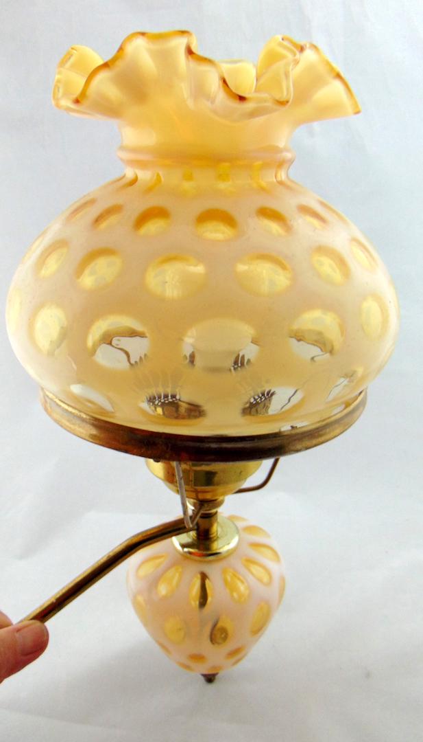 Yellow Opalescent glass wall sconce: Fenton yellow wall sconce in a windows pattern, 16" ht. Condition: good with no defects found.