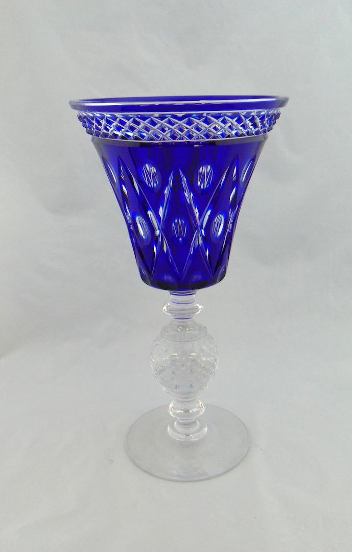Pairpoint Cobalt Cut Glass Compote: Large compote form in cobalt glass cut back to clear with a controlled bubble standard, 12" ht. Condition: good with no defects found.