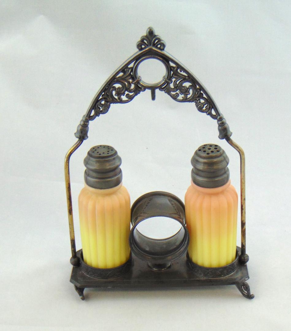 Mt Washington Burmese Condiment Set: Mt. Washington Burmese salt ad pepper ribbed pillar shaker set on an Aurora silver plate caddy, 8 1/2" ht. Condition: good with no defects found.