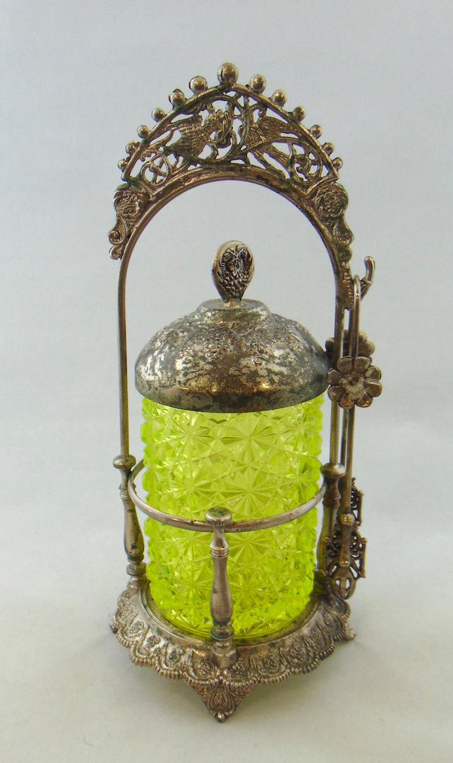 Vaseline Daisy and button glass castor: Hobbs Vaseline Daisy and Button pickle castor set in a embossed flower and bird metal caddy, 11" ht. Condition: good with no defects found, metal wear