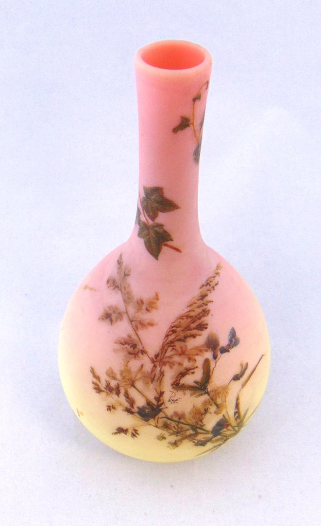 Mt. Washington Burmese vase: Bulbous stick vase decorated with branch of green foliage and ferns, 8" ht. Condition: good, later decoration.
