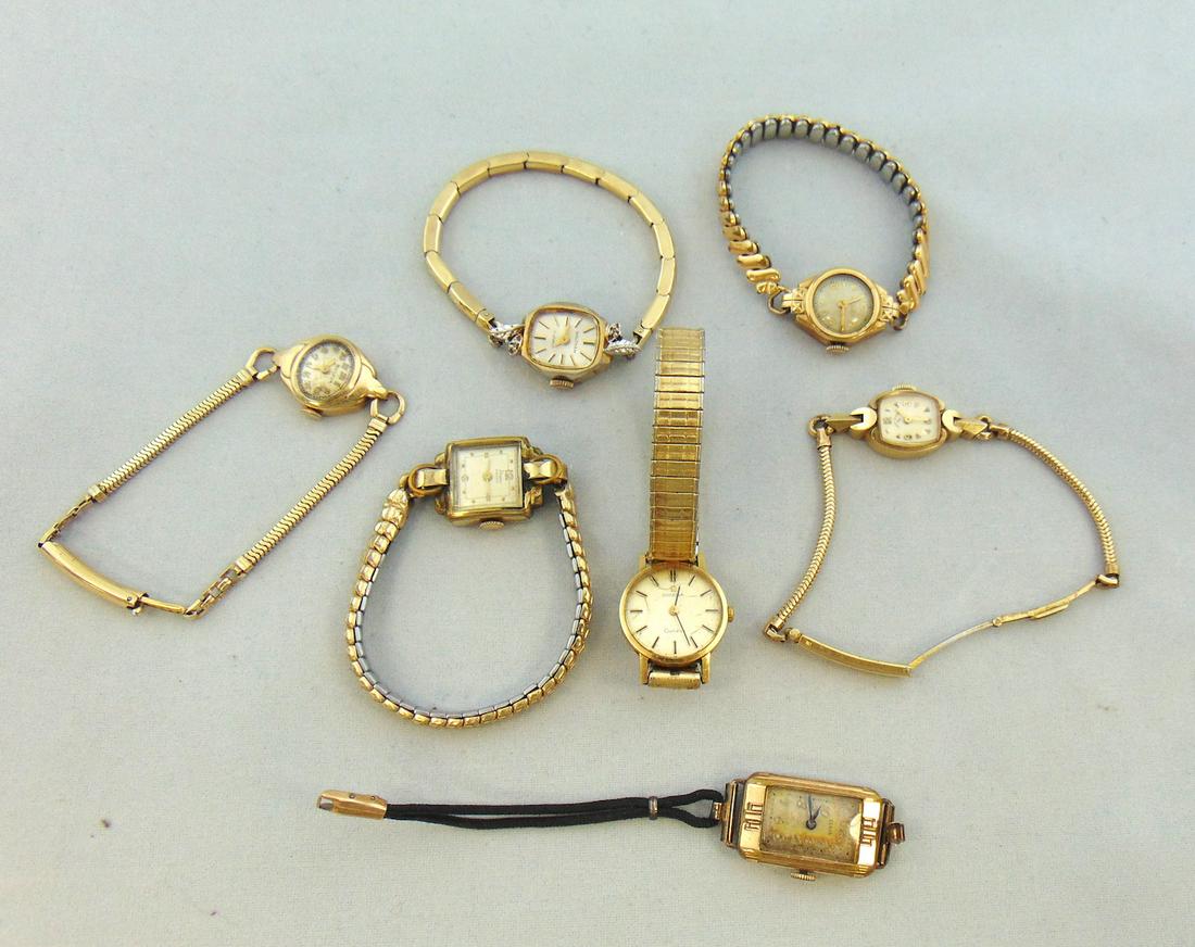 Group of Ladies watches: Including a 14k Elgin and an 18K Omega. Condition: wear commensurate with age. All currently wind but we do not guarantee working condition: