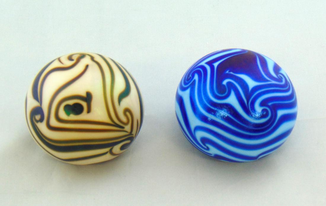 Two Early Lotton Paperweights: Two early Charles Lotton paperweights including a opal and a blue both in the King Tut patter, signed Charles Lotton 1972 and 1973, 2 1/2" wide. PROVENANCE: Earlys Auction to the Black Collection Cond