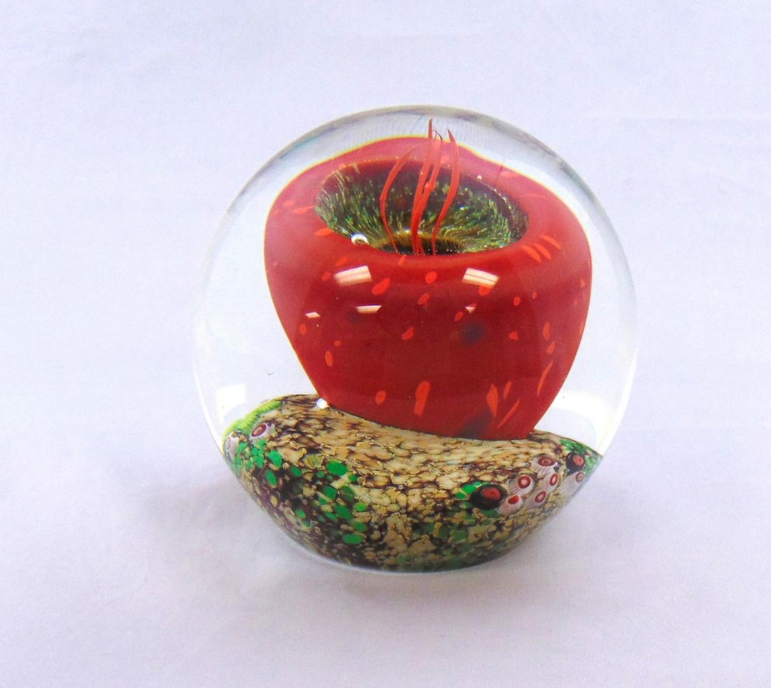 Fine Rick Satava glass Paperweight: Orb form in translucent glass decorated with a red see Urchin, signed Satava 384-05, 4" ht. Condition: good with no defects found.