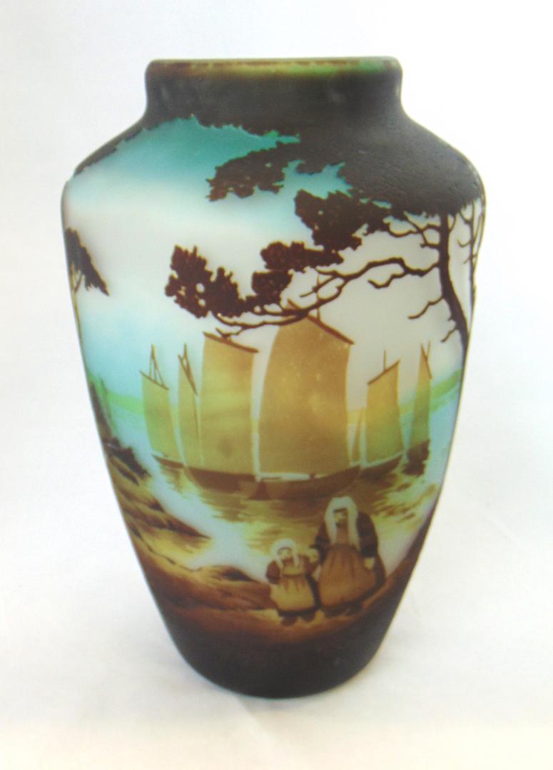 Muller French cameo glass vase: Large barrel form shouldered vase in dark brown and blue glass decorated with a ocean shoreline and two pilgrims visiting a Celtic Cross, sailing vessels anchored at the house shoreline, signed in cam