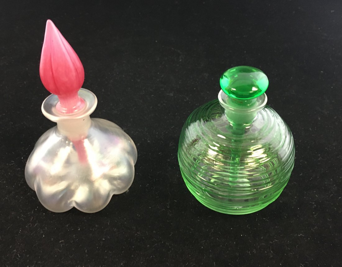 Two Steuben glass perfumes: Including a ovoid with green threading, and a melon ribbed Verre de Soie, shape number 2183, with Rosaline stopper, tallest 4 1/2" ht. Condition: good with no defects found.