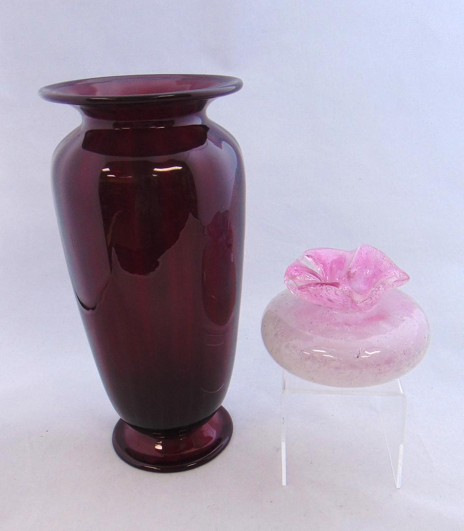 Two Steuben glass Vase: Including an ovoid squatty form vase in pink Clutha, together with a footed cylindrical form in selinium red glass with an optic striation, attributed to Steuben, tallest 10" wide. Condition: good wit