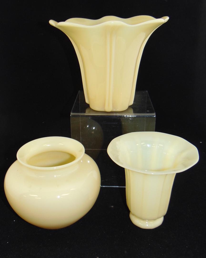 Three Steuben glass Ivory Vases: Including an Art Deco vase signed F Carder, a classic form shouldered vase together with a ribbed shade vase, 6" ht. PROVENANCE: Earlys Auction to the Black Collection Condition: good with no defects