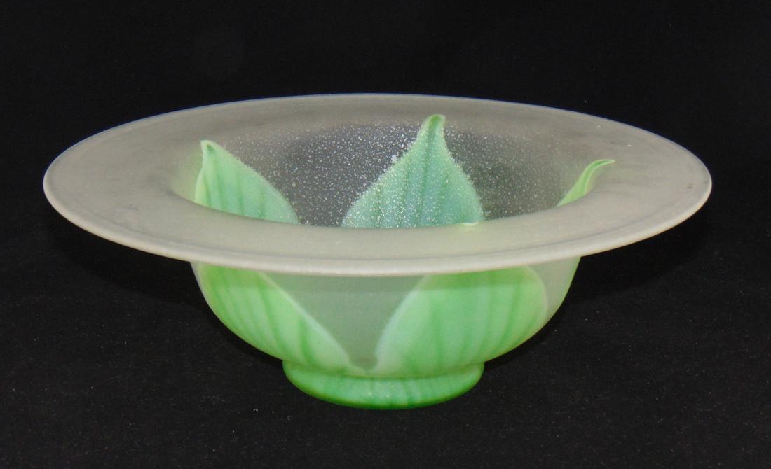 Steuben Florentine glass bowl: Large footed center bowl in frosted aventurine decorated with green pulled leaves, 12" wide. Condition: bruise on the interior that does not extend to the exterior.