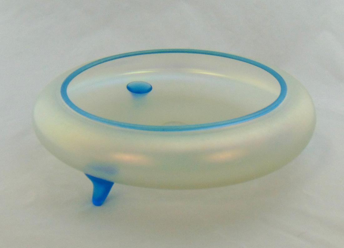 Steuben Cyprian Footed Bowl: Steuben footed low bowl in Cyprian glass with Celeste Blue adornments, carries a Rockwell Gallery paper label, 9 1/2" wide. Condition: good with no defects found.