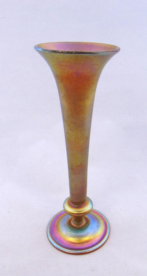 Tiffany gold Favrile glass vase: Footed Gold Favrile glass vase in trumpet form, signed 1508-6310N L. C. Tiffany - Inc. Favrile, 8" ht. good with no defects found