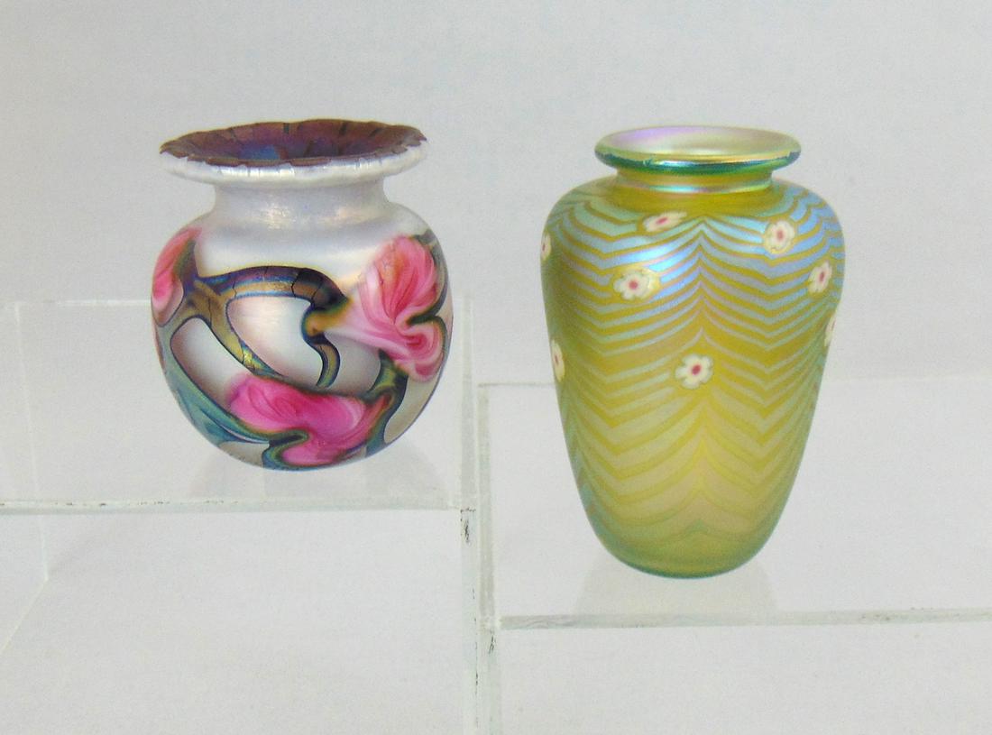 Two diminutive art glass vases: Including a John Lotton in opal glass with a red heart and vine design together with a shouldered Rick Satava in a coil design, both signed, tallest 3 1/4" ht. Condition: good with no defects found.