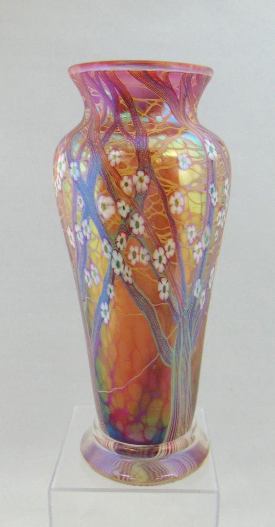 Orient and Flume Large Wisteria: Footed cylindrical shouldered vase in Crimson glass decorated with a tree of white Millefiori, signed Orient and flume Beyers Sillars, 11 1/2" ht. Condition: good with no defects found.