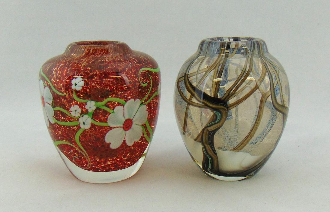 Two Orient and Flume glass vases: Both ovoid paperweight form one in a tree winter scene the other a mottled red with large white flowers, both signed winter signed with artist Bruce Sillars, 4 1/4' ht. Condition: good with no defects