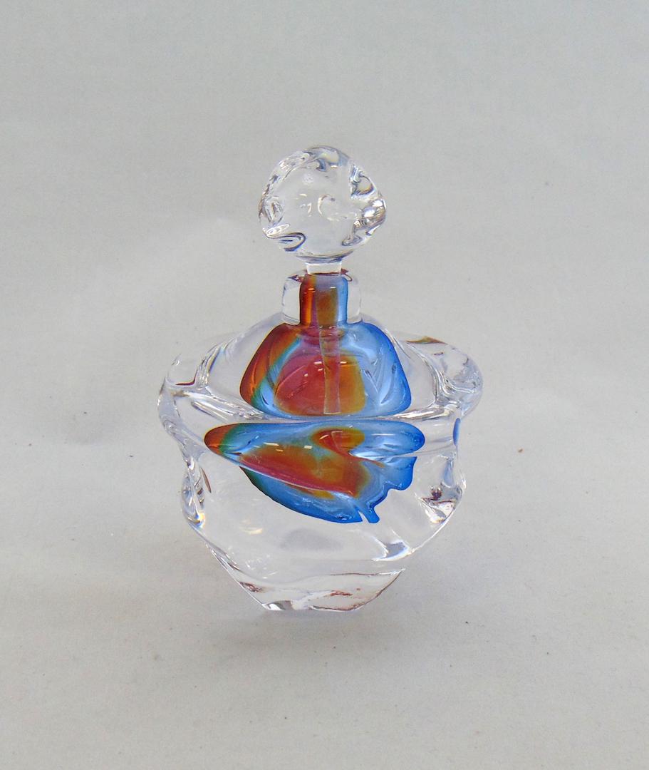 Leon Applebaum glass perfume: Globular form in a heavy glass swirl pattern decorated with a colorful core of rose, blue and yellow, signed Leon Applebaum 5" ht. Condition: good with no defects found.