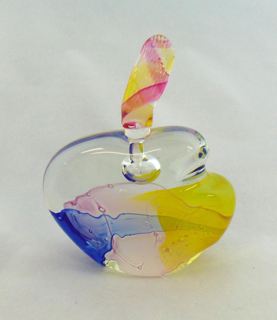 Leon Applebaum glass perfume: Translucent glass in a organic form with splashes of yellow pink and blue fitted with a candy stripe stopper, signed Leon Applebaum, 8" ht. Condition: good with no defects found.